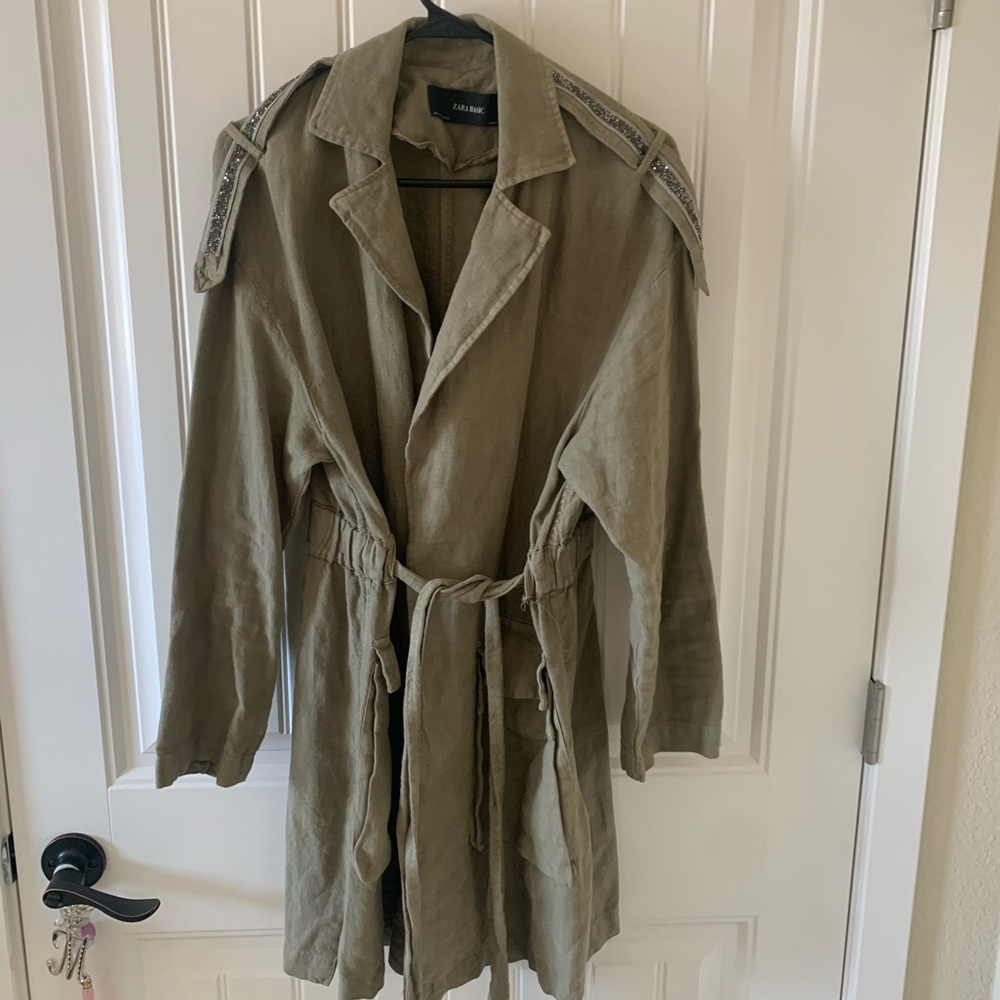 Green coat with a bit of sparkle.
